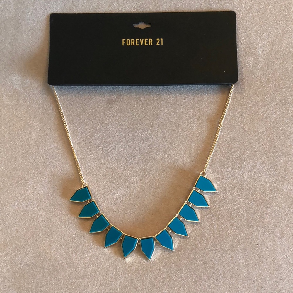 Gold necklace with turquoise teeth